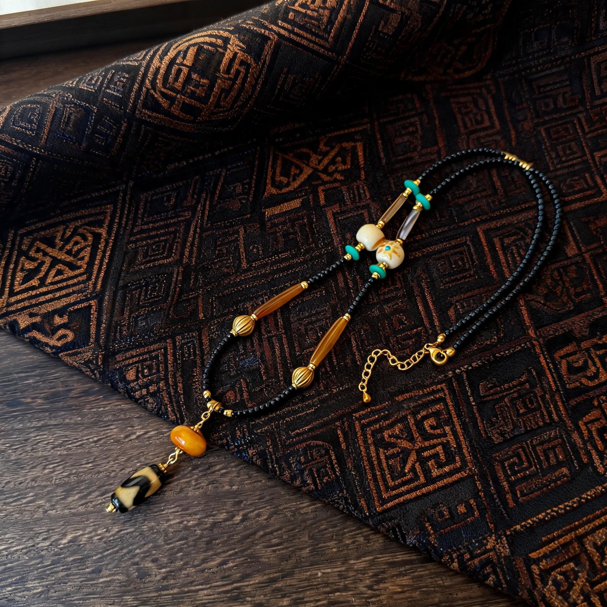 Kumbu tiger tooth dzi bead amber necklace main flat lay