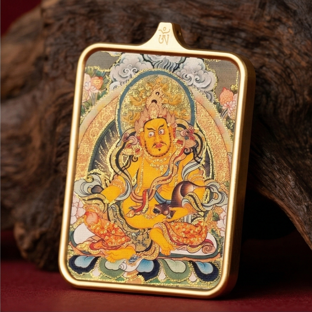 Yellow Jambhala thangka pendant detail