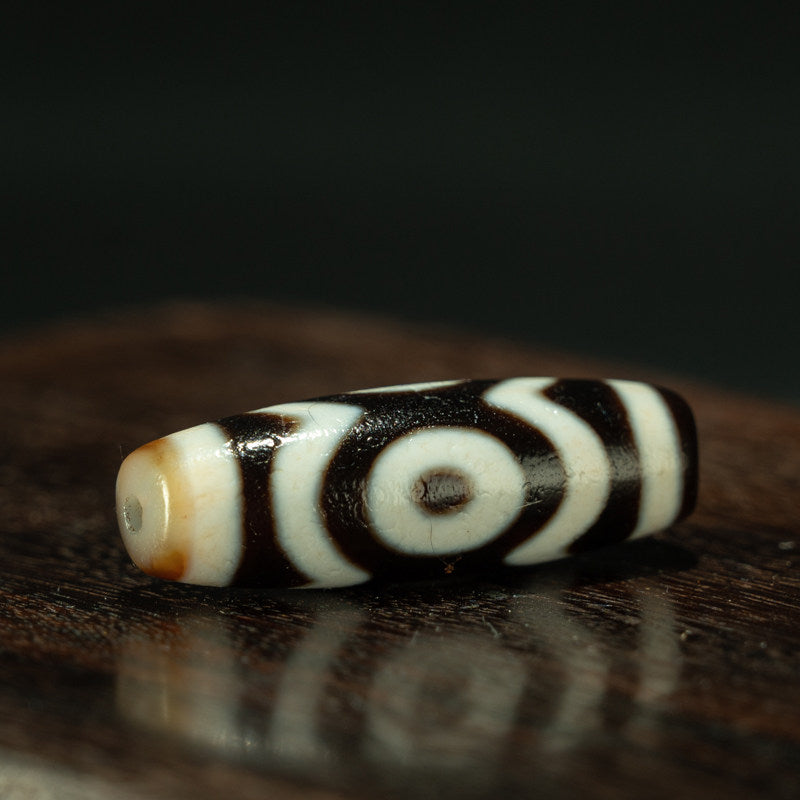 Pure dzi bead three eye motif close up