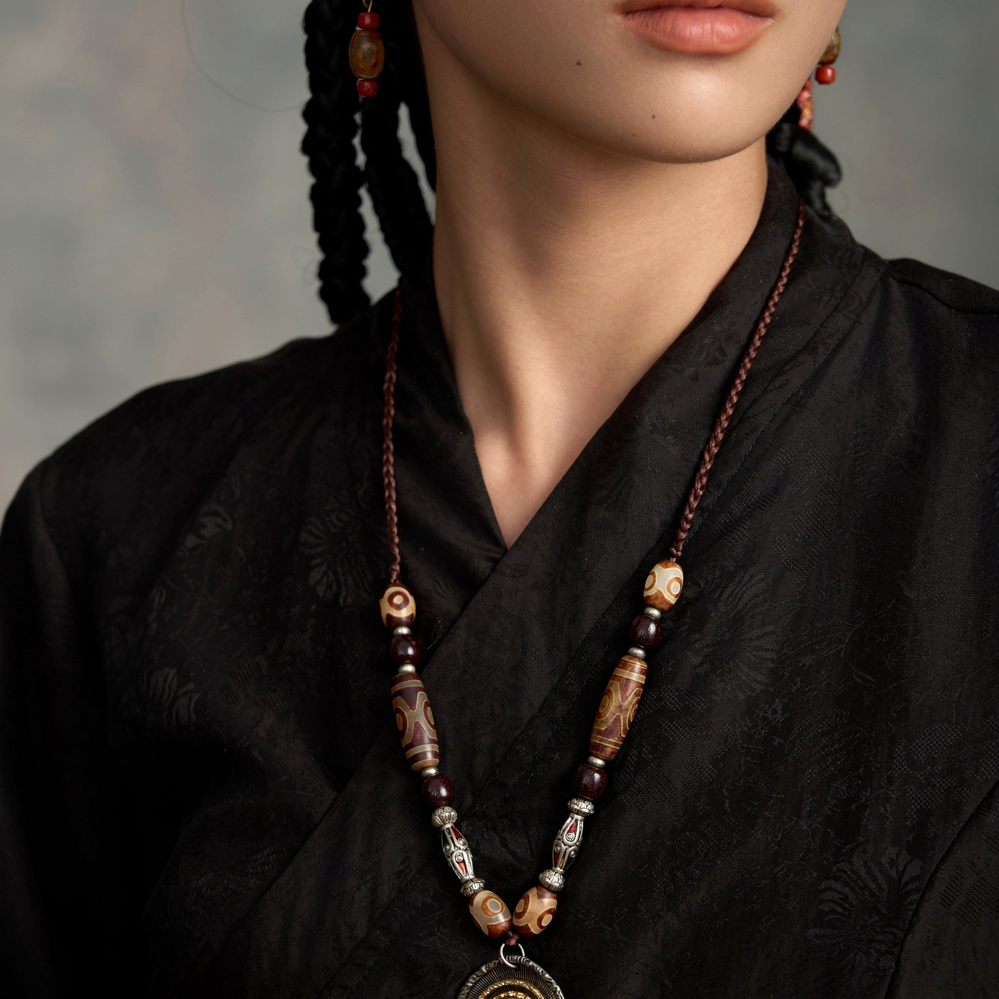 handcrafted Nepalese medicine eye Dzi bead necklace gray white proportional wearing view