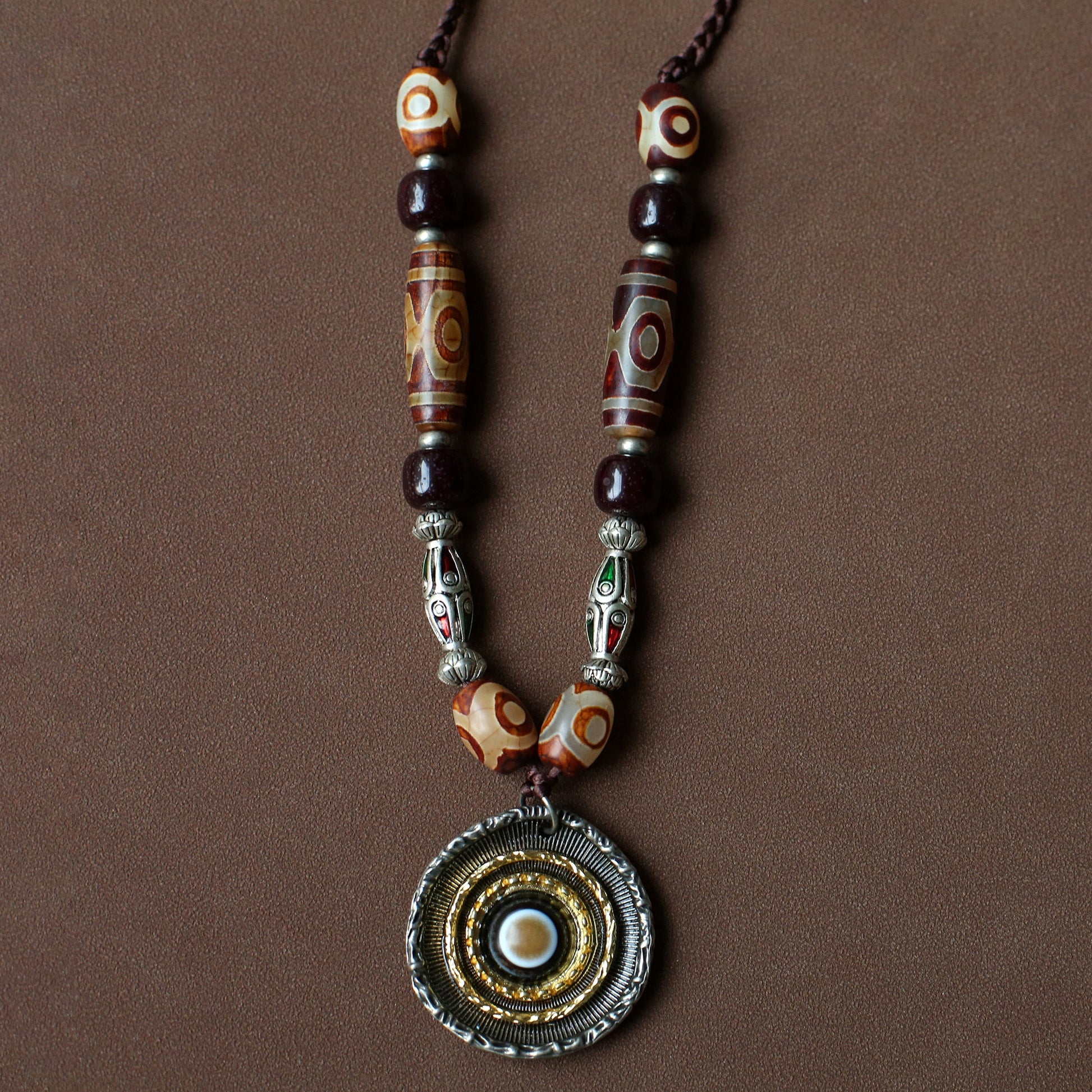 handcrafted Nepalese medicine agate Dzi bead necklace red brown front view