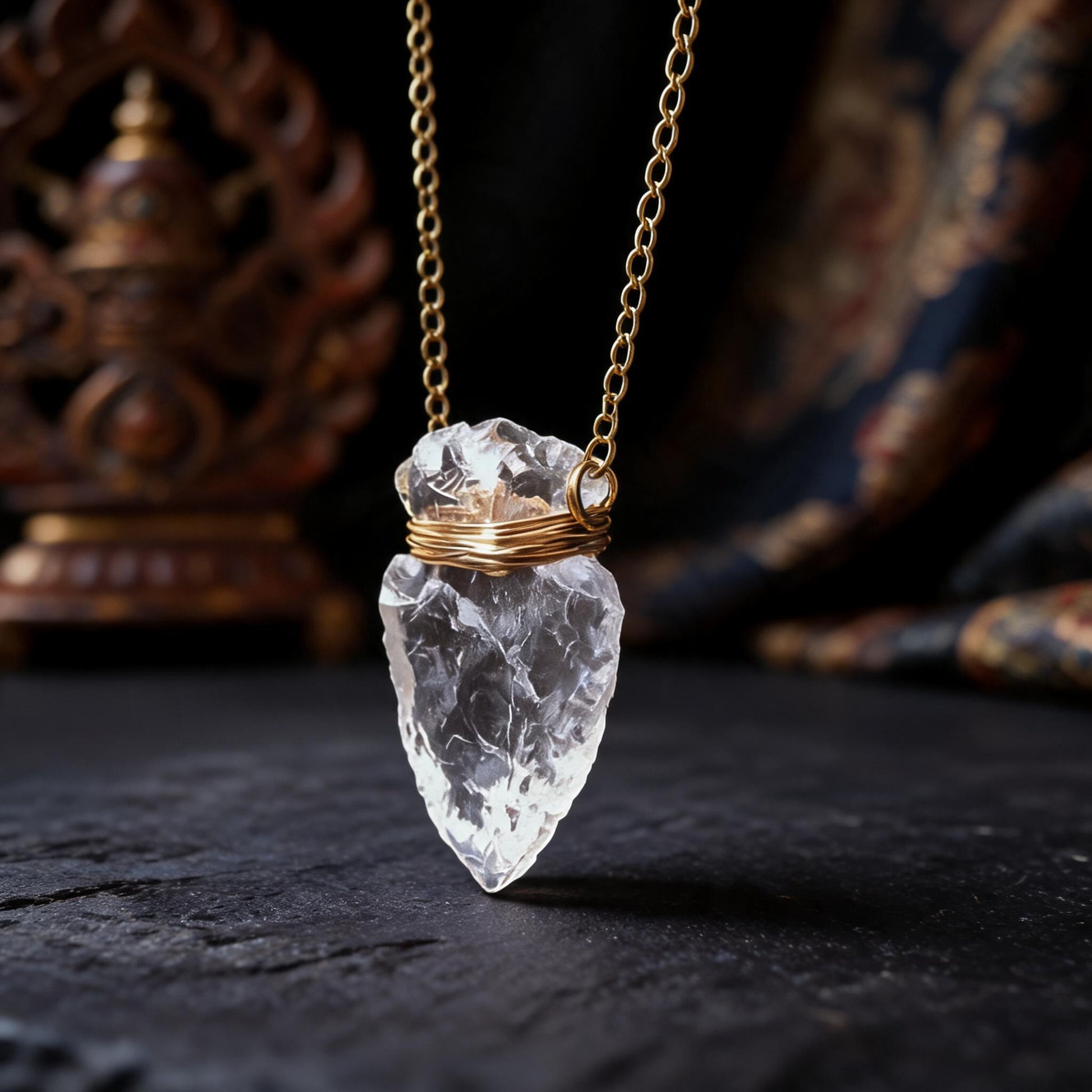 Clear quartz arrowhead pendant necklace with gold wrapped chain three quarter view