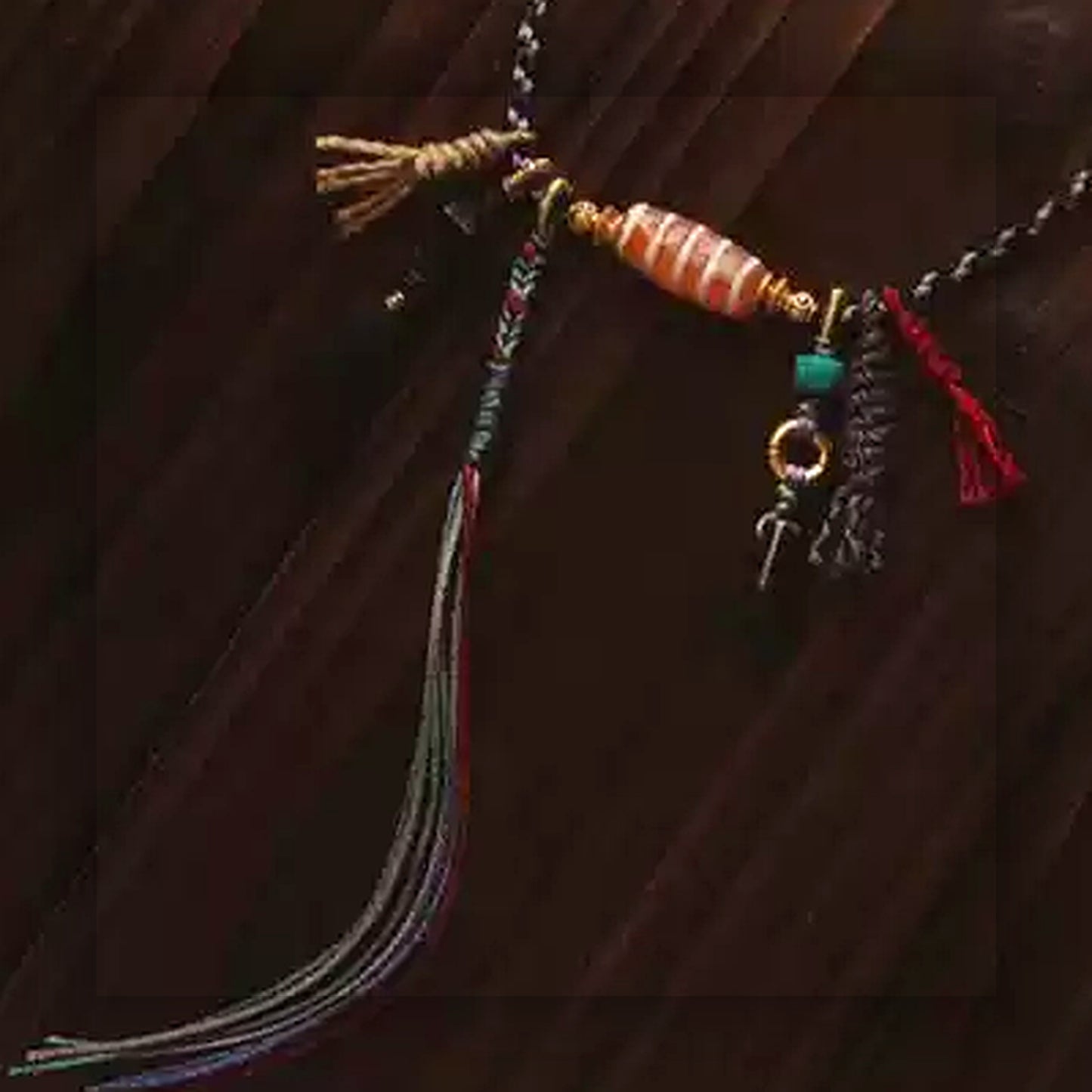 Handcrafted Tibetan agate Dzi bead multi strand necklace cord and tassel detail
