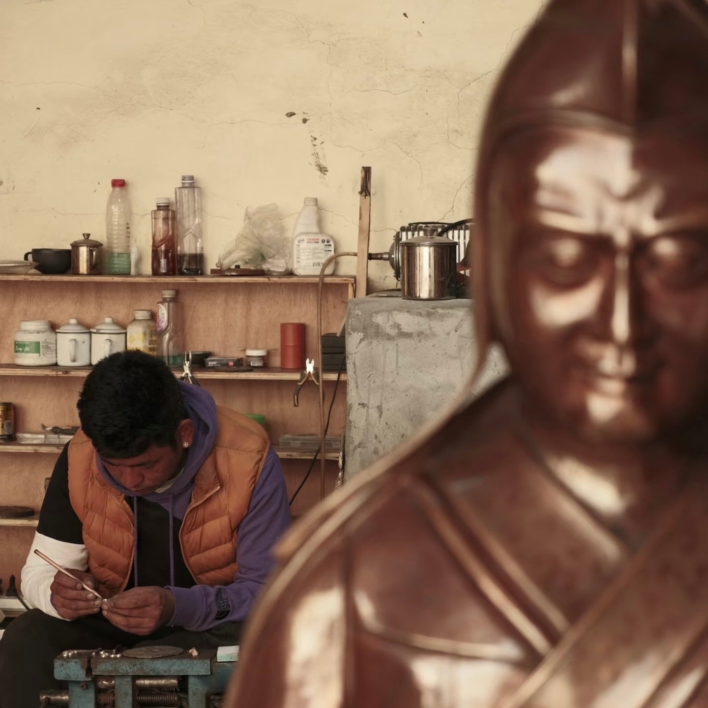 Sangye painting in the workshop